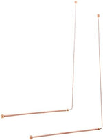 Close up of pure copper dowsing rods with ball ends