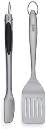 Weber stainless steel slotted spatula closeup showing embossed logo