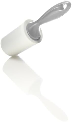 Scotch-Brite lint roller removing fuzz from dark navy clothing.