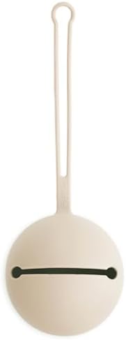Mushie silicone pacifier pouch showing open compartment containing two baby pacifiers