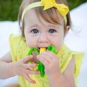 Baby Banana Cornelius corn teether showing easy grip husk handles
