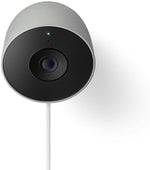 Google smart security camera mounted on an outdoor brick wall.