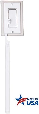 Two white rocker light switch extenders for children