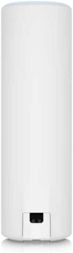 Ubiquiti Networks enterprise grade Wi-Fi 6 access point placed on an indoor office desktop.