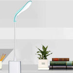 Generic portable book night light plugged into a laptop keyboard port illuminating keys