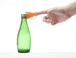 Close up of flexible vinyl miniature hands worn on human fingertips.