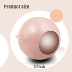 Compact pink and rose gold lint remover stored in a travel handbag