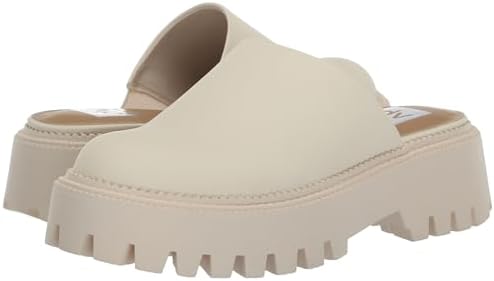 Angled view of Dolce Vita Lexy lug sole mule in ivory