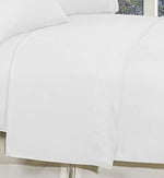 Elegant Comfort white flat sheet neatly folded displaying its wrinkle free quality.