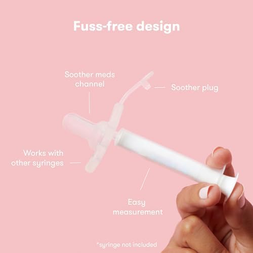 Infant using Frida Baby medicine dispenser pacifier