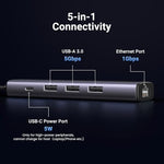 UGreen USB 3.0 ethernet adapter connected directly to a modern slim laptop interface on an office desk setup.