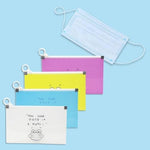 Yellow mask organizer case showing durable plastic texture