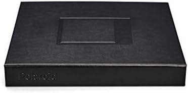 Authentic Polaroid large photo book styled on a modern table surface