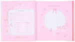 Infant girl memory scrapbook close up showing the detailed floral and butterfly cover motifs