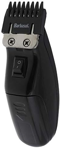 Barbasol electric grooming tool close up on the sharp stainless steel trimmer head for clean detailing.