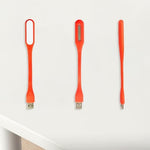 Generic compact orange night light bulb detailed view of the USB port