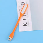 Generic small USB emergency light illuminating a dark room via power bank connection
