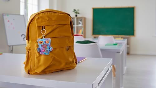 Fuggler ZURU keychain attached to a backpack for scale