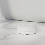Wireless Ring Flood and Freeze Sensor white device for leak and temperature monitoring.