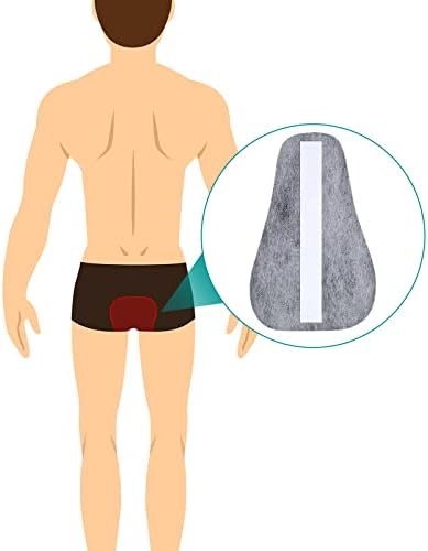 Hand holding a discreet charcoal odor filter for size comparison