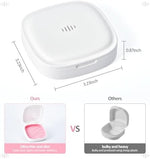 Open orthodontic storage container showing pink removable silicone tray