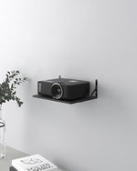 Close up of metal wall mount for streaming devices