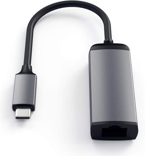 Satechi Ethernet adapter connected to a MacBook Pro showing premium metal finish