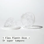 Disposable plant-based menstrual disc being pinched for easy insertion using the flexible rim.