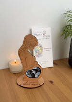 Heart's Sign ultrasound frame being presented as a baby shower gift for an expecting mom.