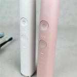 White premium toothbrush host handle showing sleek ergonomic design and attachment shaft