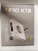 FiiO twenty four bit fully differential complementary resistor ladder amp unit displayed at an angle