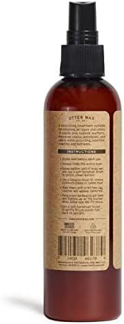 Applying Otter Wax conditioning spray to a suede boot for blemish removal.