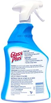 Cleaning windows with Glass Plus imported glass cleaner for a clear finish
