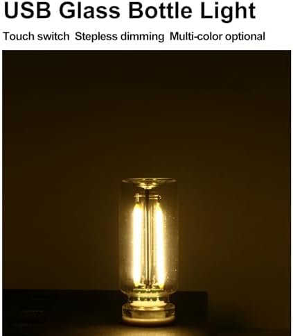 Dozyix decorative glass bottle night lamp illustrating its tiny size compared to a hand