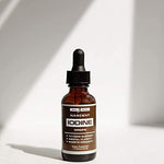 Close up of the glass dropper cap on the Nascent Iodine supplement bottle demonstrating the easy dosage control mechanism.