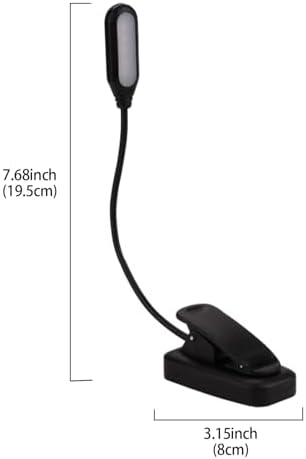 Portable LED reading light clipped onto a headboard