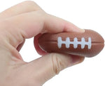 Multiple miniature sports stress balls scattered on a table for party decoration inspiration