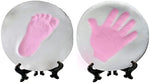 Novarena personalized baby footprint keepsake displayed as nursery wall decor with ribbon.