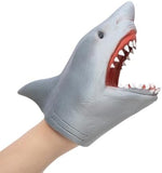 Child hand inside Schylling Shark Hand Puppet for imaginative roleplay.