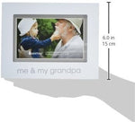 Close up angle of the white wooden border and glass cover on the Pearhead baby keepsake frame.