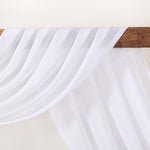 White chiffon background curtain used as a romantic photo booth backdrop