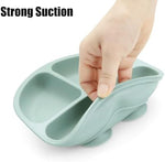 Toddler using PandaEar divided plate for self-feeding practice