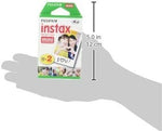 Fujifilm credit card size glossy instant prints showing vibrant color development and monochrome portrait options.