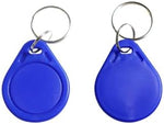 Bulk pack of one hundred blue ETEKJOY proximity IC card tags arranged clearly to show the durable construction and metallic attachment rings.