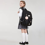 Abshoo student laptop daypack packed with school books, stationery items, and tech gear.