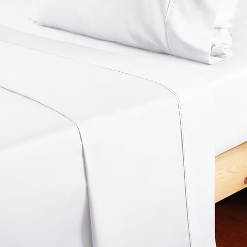 Side view of the single piece white queen size flat sheet draped elegantly