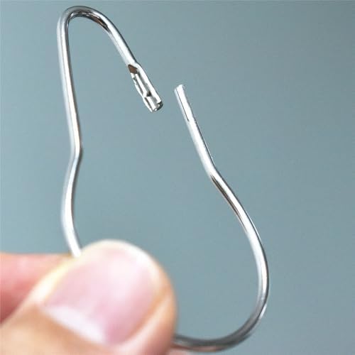 Close up view of rustproof metal shower curtain rings with secure snap closure.