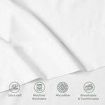Crisp white imported luxury flat sheet styled in a modern bedroom setting.