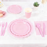 Ohkishly pink party supplies featuring forks knives and spoons.
