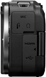 Top view of Canon mirrorless camera body highlighting control dials and hot shoe